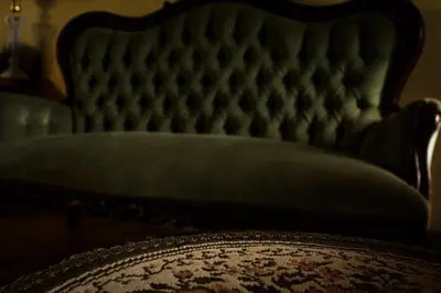 a close up of a couch in a room at The Red Oak Guesthouse in Tzaneen