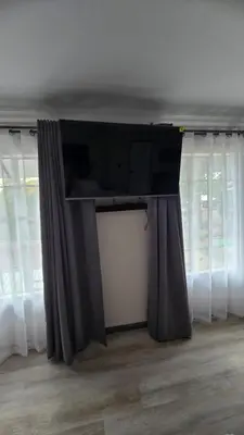 a stage with curtains and a tv in a room at Lavender Lofts in Centurion