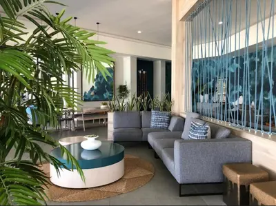 a living room with a couch and a table at Luxurious 1-Bedroom Apartment at The Blyde, Pretoria in Pretoria