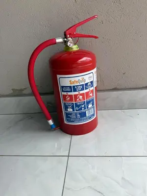 a fire hydrant with a red hose attached to a wall at Flora Haven in Polokwane