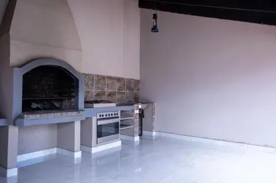 a kitchen with a stove and an oven in it at Flora Haven in Polokwane