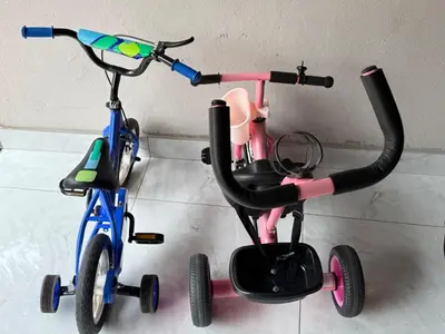 two childrens tricycles parked next to a wall at Flora Haven in Polokwane