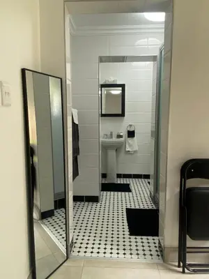 a bathroom with a sink and a mirror at Sleep on 489 in Pretoria