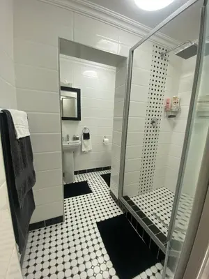 a bathroom with a shower and a toilet and a sink at Sleep on 489 in Pretoria