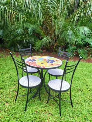 a table and two chairs and a table with a table and chairs at Mediterranean Palms in Pretoria