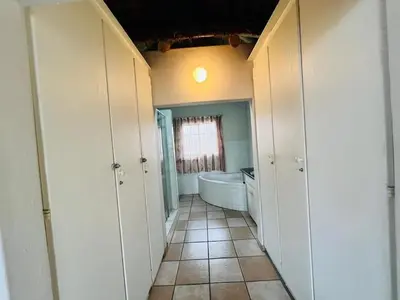 a bathroom with a tub and a toilet and a sink at Akunandaba - A Bush Retreat in Marloth Park