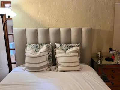 a bed with two pillows on top of it at Private room with en-suite bathroom in Pretoria