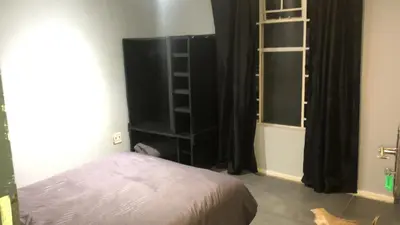 a bedroom with a bed and a window at The Chardonay Inn in Centurion