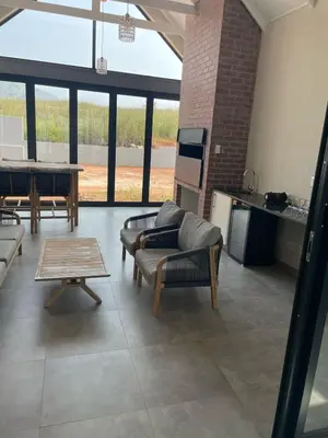 a large living room with couches and a table at The Gorge View at Highland Gate in Dullstroom