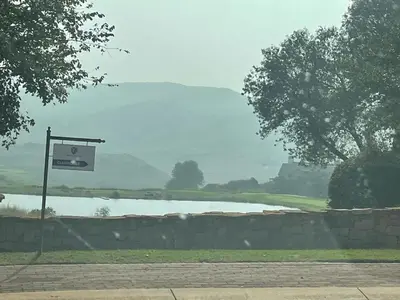 a basketball hoop in front of a lake at The Gorge View at Highland Gate in Dullstroom