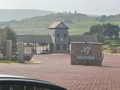 a car parked in front of a gas station at The Gorge View at Highland Gate in Dullstroom