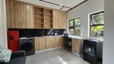 a kitchen with a washer and a dishwasher in it at Exclusive Stay in Secure Estate in Pretoria