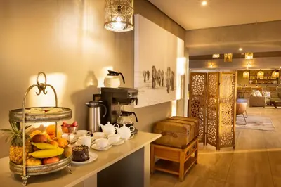 a kitchen with a counter with food on it at Elephant Walk Tented Camp in Komatipoort