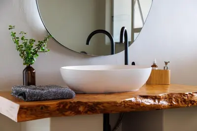 a bathroom with a bowl sink and a mirror at Enso Botanico Boutique Villa, Kosmos in Hartbeespoort