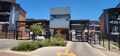 an empty street in a city with buildings at Olive view Retreat in Midrand
