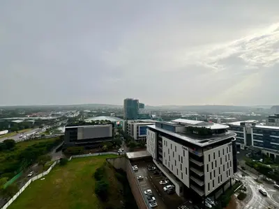 an aerial view of a city with buildings and cars at Deluxe fully furnished apartment in Menlyn Maine residence 1209 in Pretoria