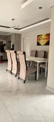a group of chairs around a table in a room at Ee40Yethu in Pretoria
