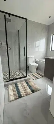 a bathroom with a glass shower and a toilet at Ee40Yethu in Pretoria