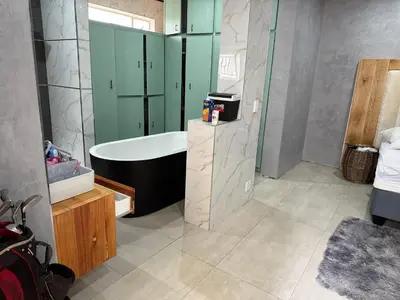 a bathroom with a bath tub and a shower at Kruger Place in Mokopane