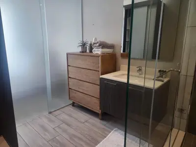 a bathroom with a sink and a shower at Menlyn Maine Residences 1317 in Pretoria