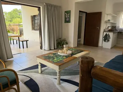 a living room with a table with candles on it at Wittus Retreat in White River