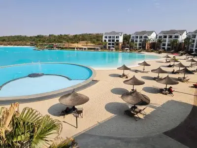 a group of umbrellas and a pool of water at The Blyde Crystal Lagoon in Pretoria