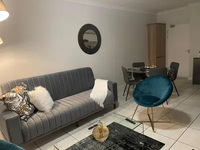 a living room with a couch and a table at The Blyde Crystal Lagoon in Pretoria