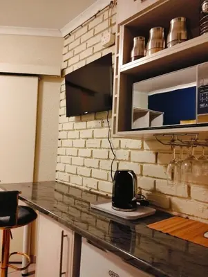 a kitchen with a counter top and a microwave at Aneiwa airport lodge in Kempton Park