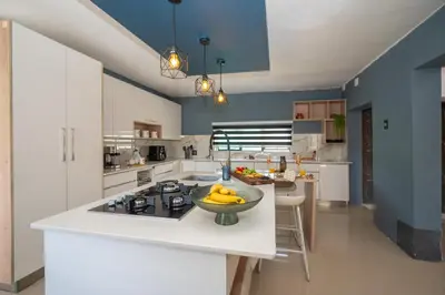 a kitchen with a bowl of bananas on a counter at Grace House, Mkhuhlu, spacious 4-bedroom house in Belfast