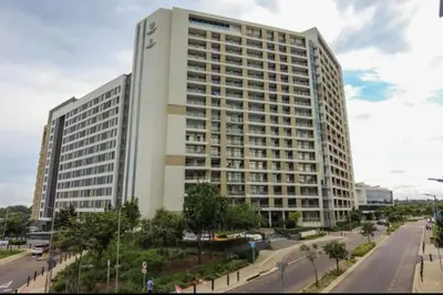 a large white building with a street in front of it at Luxury AT Maine in Pretoria