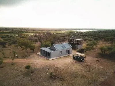 an aerial view of a house in a field at Die Skoen in Dinokeng Game Reserve