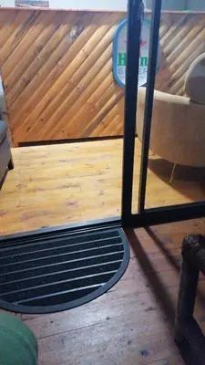 a view of a living room with a wooden floor at The Man Cave in Sabie