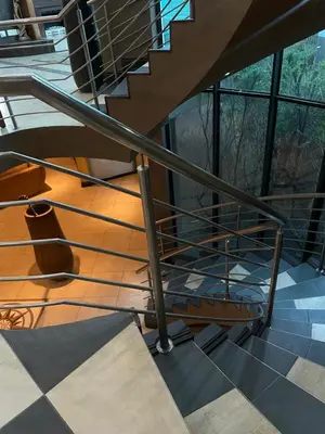 a spiral staircase in a building with a window at Irene Villa in Irene