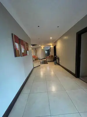 a living room with a large white tile floor at Irene Villa in Irene