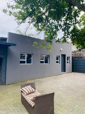 a couch sitting in front of a house at Linies guest house in Benoni
