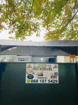 a sign on the side of a gas station at Linies guest house in Benoni