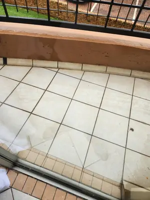 a white tiled floor next to a bench at Executive Harmonic Studio in Midrand