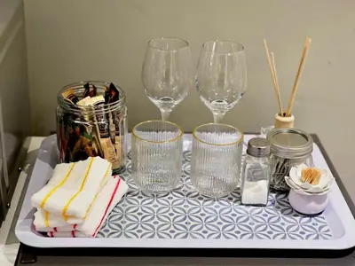 a tray with wine glasses and other items on it at The Barn Haven in Kyalami