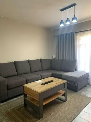 a living room with a couch and a coffee table at Hantam Suites in Centurion
