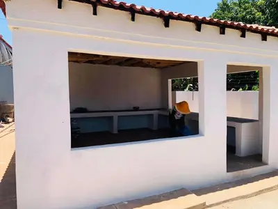 a window in the side of a white building at AA Nkhumeleni Guesthouse and Accomodation in Thohoyandou