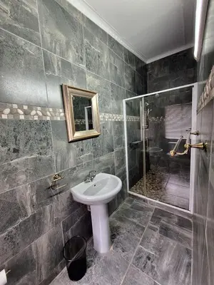 a bathroom with a sink and a shower at 14a on Middle Way in Tzaneen