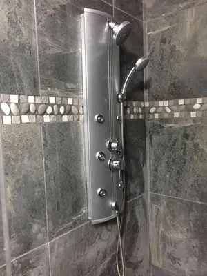 a shower with a shower head in a bathroom at 14a on Middle Way in Tzaneen