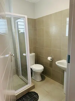a bathroom with a toilet and a sink at Calm & Cozy Apartment 2 in Pretoria