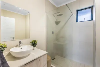 a bathroom with a sink and a shower at BinBins Suite Haven in Midrand
