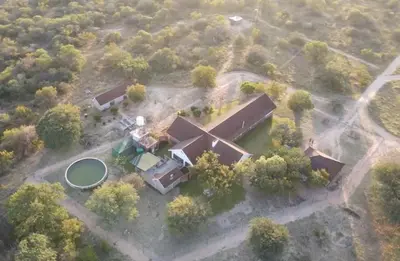 an aerial view of a house with a green circle at Harmonie Hills in Sukani