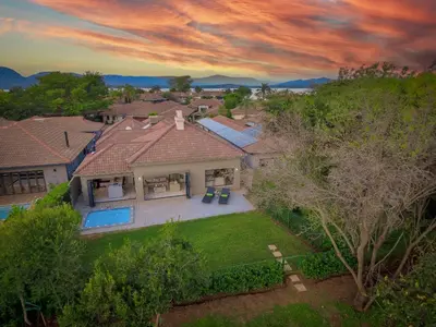 an aerial view of a house with a yard at Bunkers Paradis at Pecanwood in Hartbeespoort