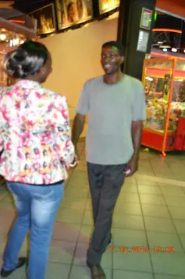 a man and a woman walking through a store at Ramaderama in Pretoria