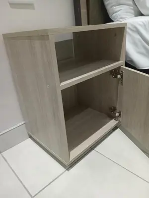 a wooden cupboard with two shelves on the floor at Ramaderama in Pretoria