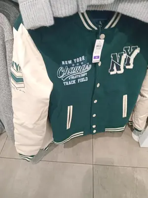 a green jersey on display in a store at Ramaderama in Pretoria