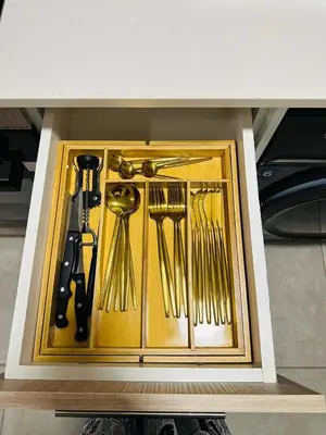 a drawer filled with gold utensils in a kitchen at Homely Stay 4 in Kempton Park
